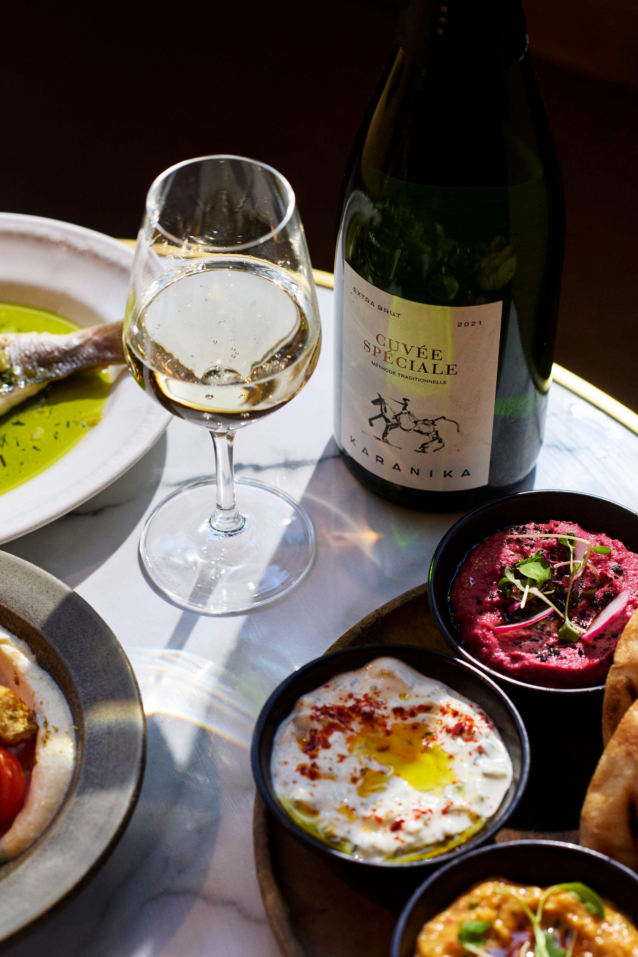 Greek Wine on a table with mezze